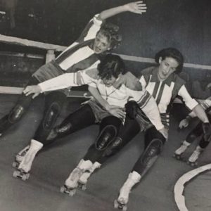 Original roller derby roller skating on a banked track with a womens team in Chicago 1935.