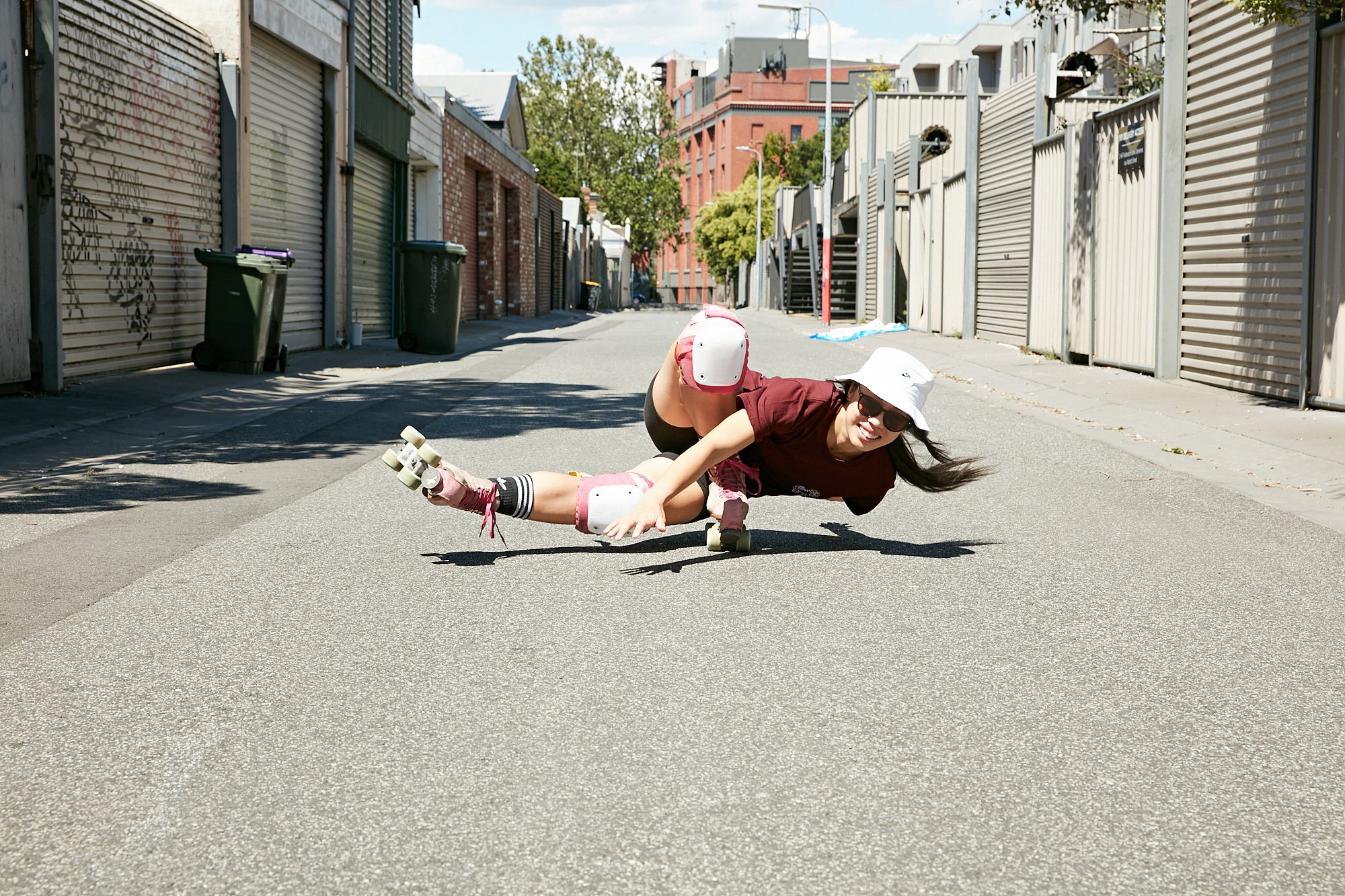 RollerFit Coach Genevieve does and impressive coffin on roller skates in a Melbourne laneway.