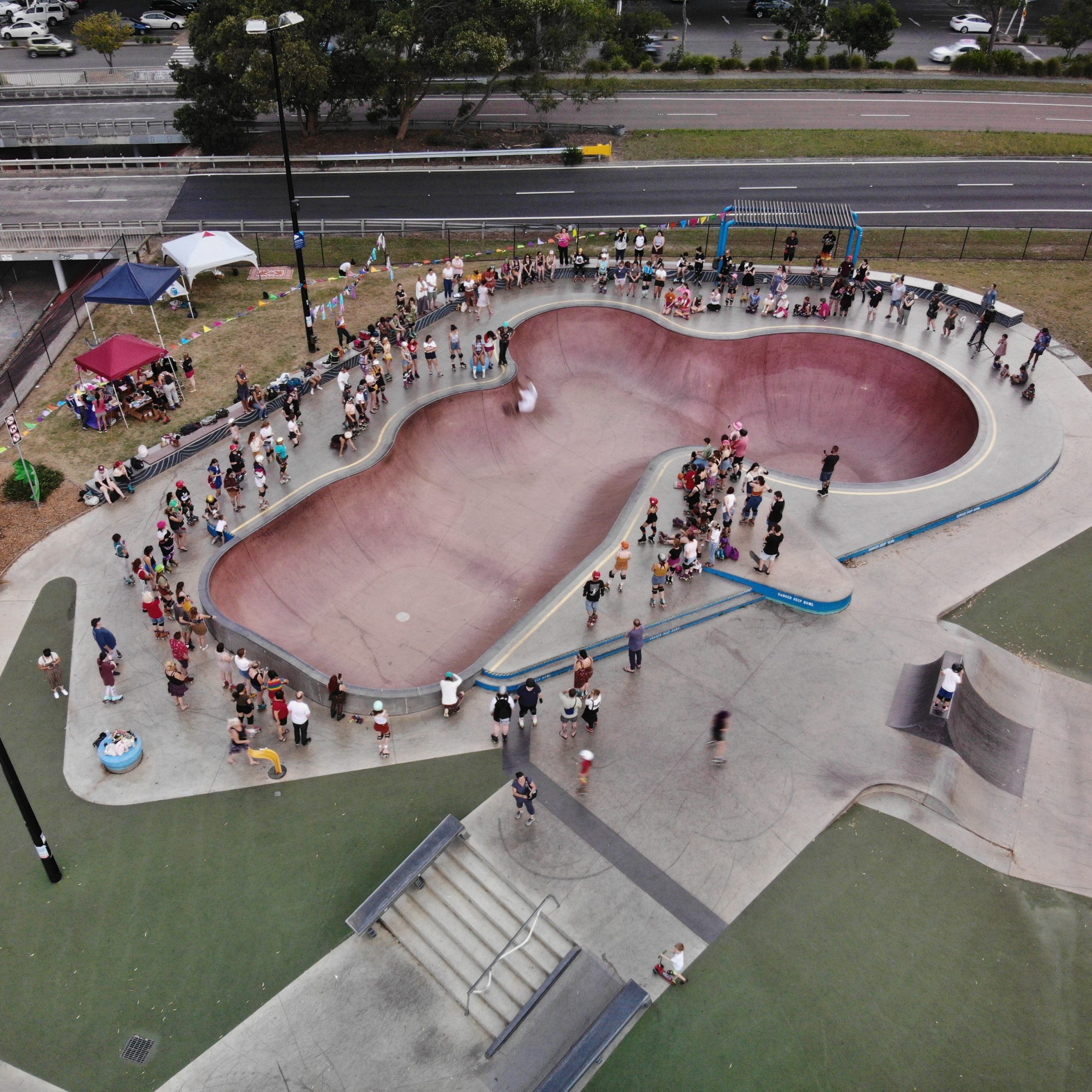 Aerial shot of the big skate bowl at Bato Yard skatepark during the demo of Moxi x RollerFit Skate Fest in 2019