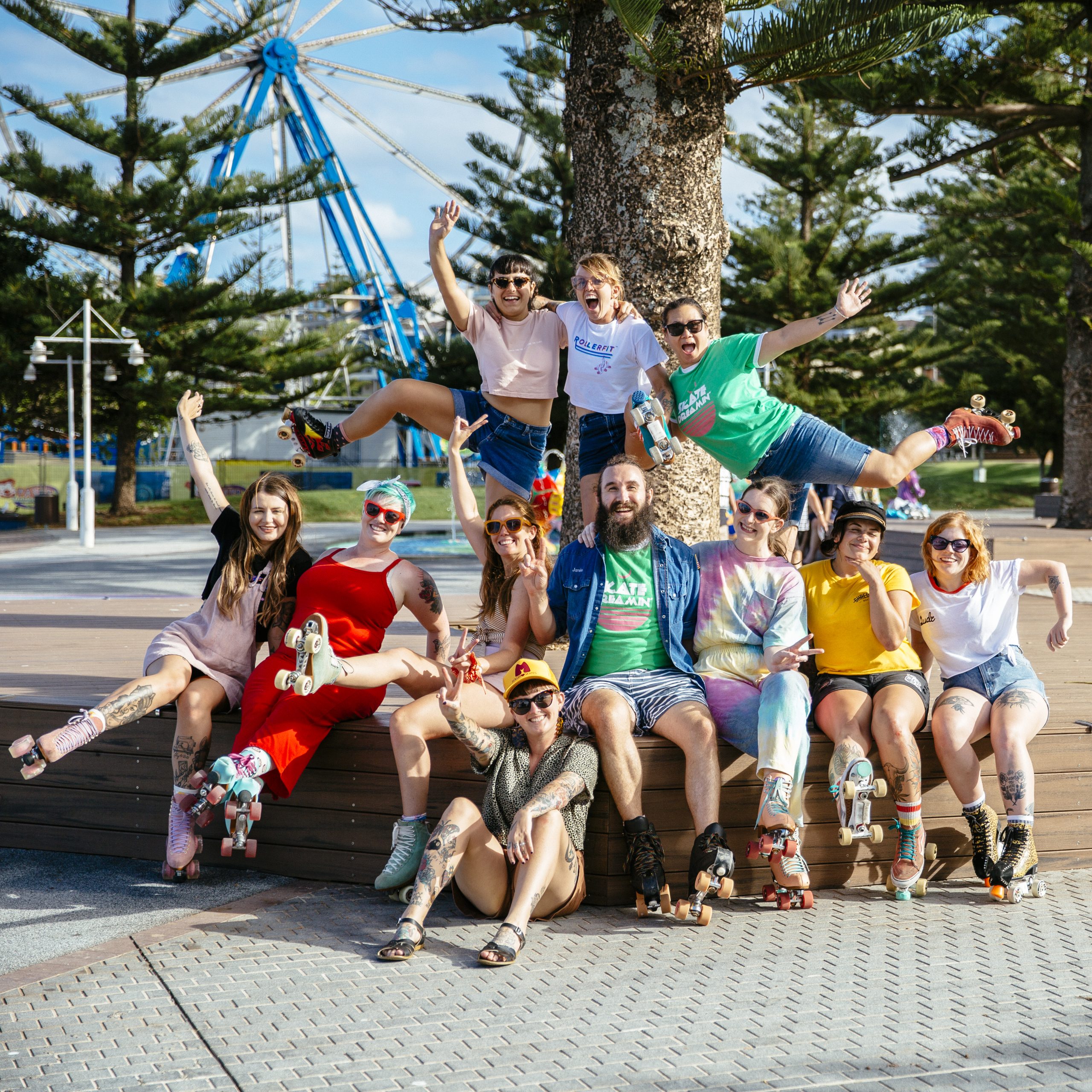 A bunch of RollerFit roller skaters in a group shot with huge smiles on their face