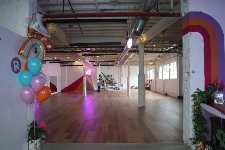 RollerMart roller skating studio available for kids parties and venue hire in Waterloo Sydney. The expansive studio space with warm wooden floors and bright murals.